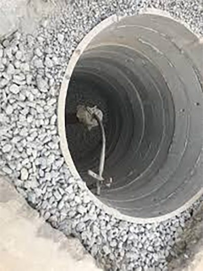 Ring well lined with blue metal around the bore pipe
